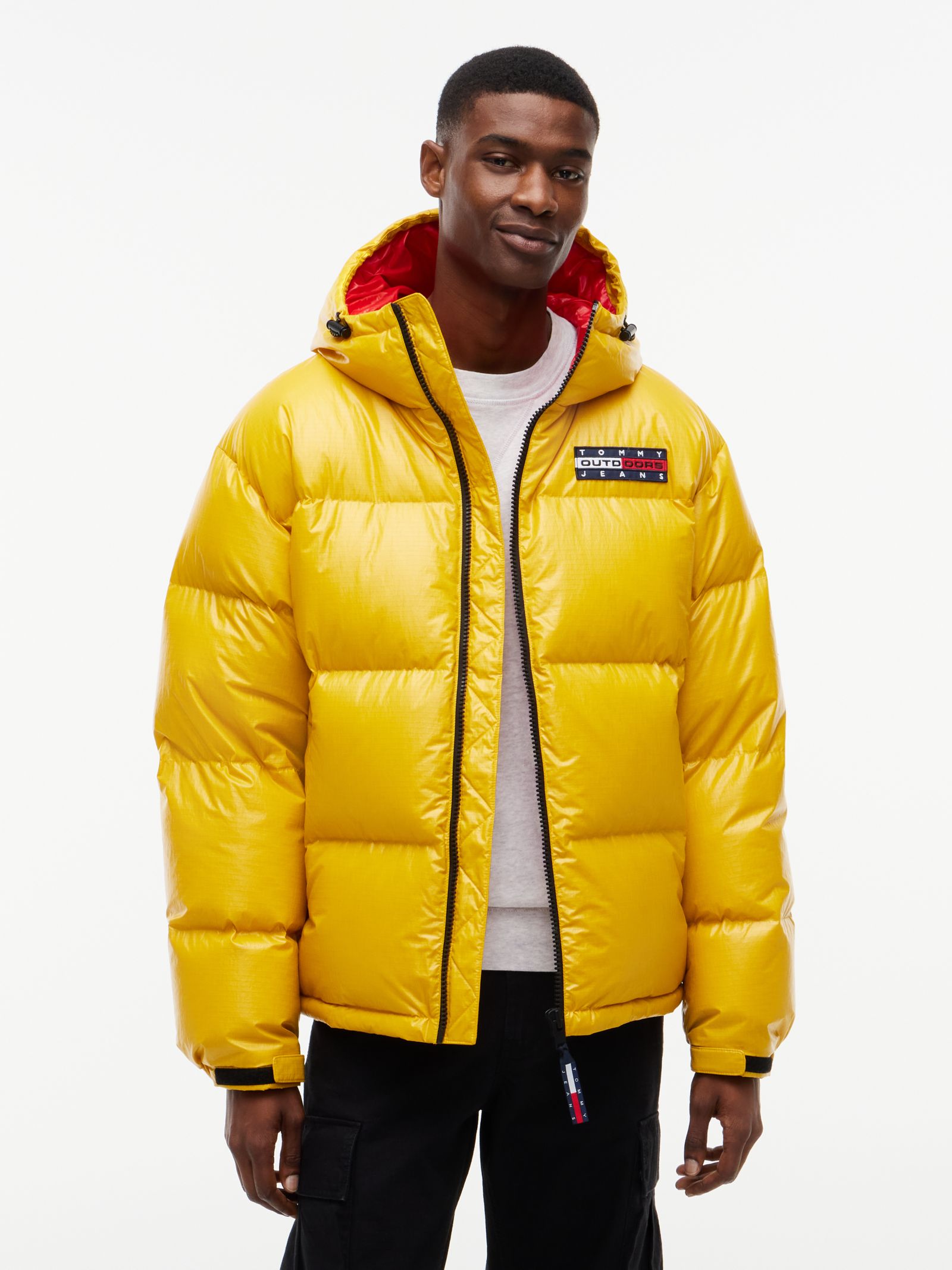 Tommy Jeans Glanzend Alaska pufferjack met dons en capuchon for men in geel